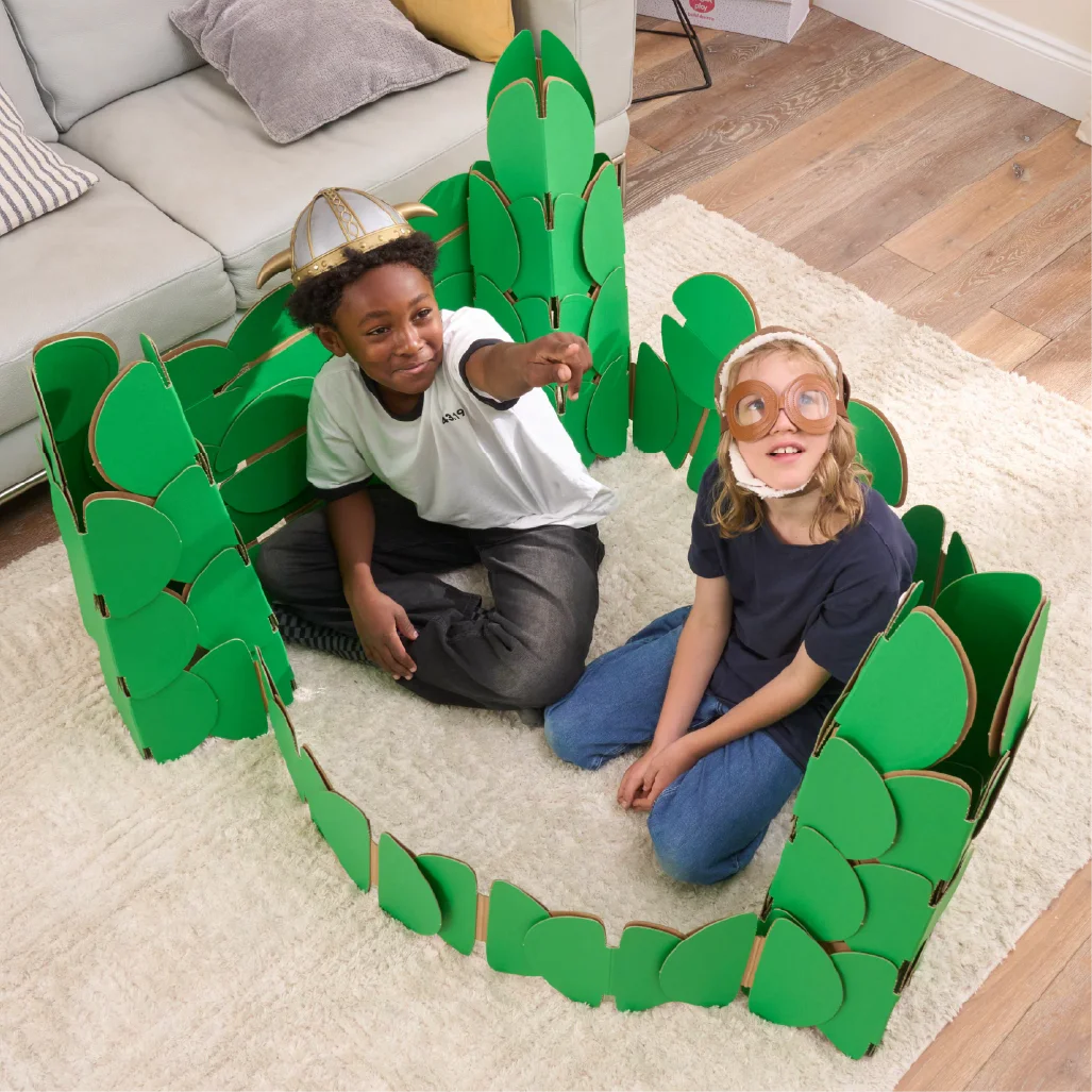 Two boys, in a living room, playing in a fort made out of a noook play® building kit.
This fort took 76 noook play® discs to build.