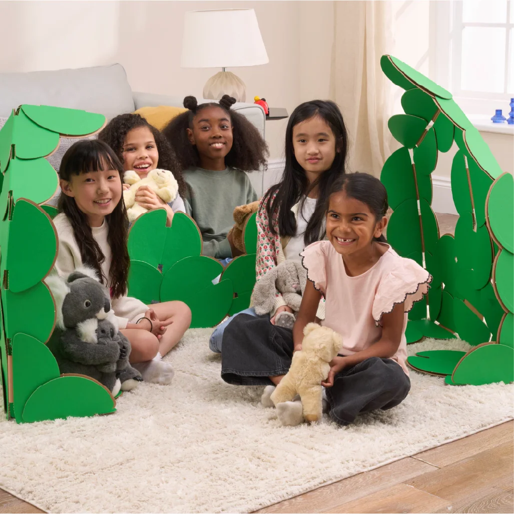 Five happy girls are having a party in a living room, with their teddies and a den made out of a noook play® building kit.
This Party House took 54 noook play® discs to build.
