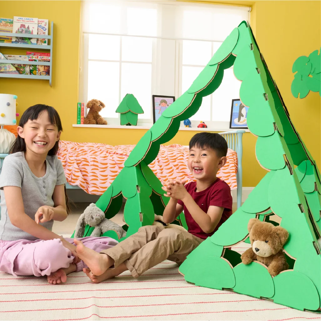 A brother a sister are playing 
with their teddy bears in a large pyramid made out of a noook play® building kit. Other objects in the children's' bedroom are also made of out of noook play® discs.
This pyramid took 69 noook play® discs to build.