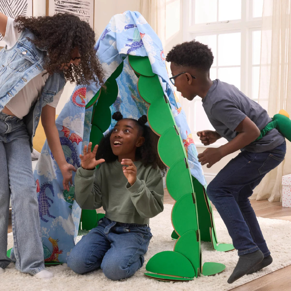 Three kids are playing in a living room, pretending to find dragons in a lair made out a noook play® building kit. The noook® den supports a sheet with dragons on.
This Dragon's Lair took 30 noook play® discs to build.