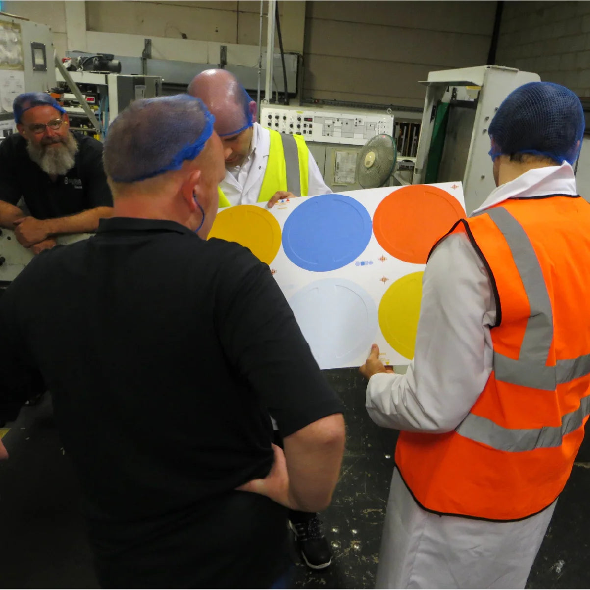 Torsten Sherwood inspecting a sample of noook® discs being made at our factory.