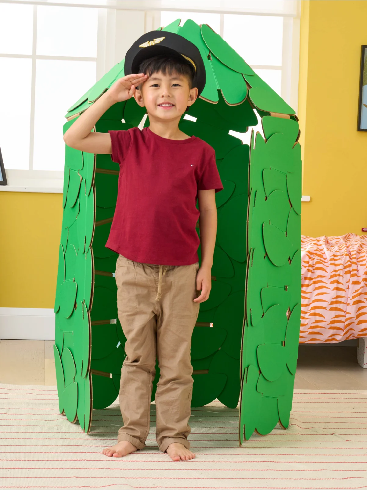 A little boy pretends to be a palace guard, protecting his bedroom from his sister, with a Guards' Hut made out of a noook play® building kit.
This guard hut took 91 noook play® discs to build.