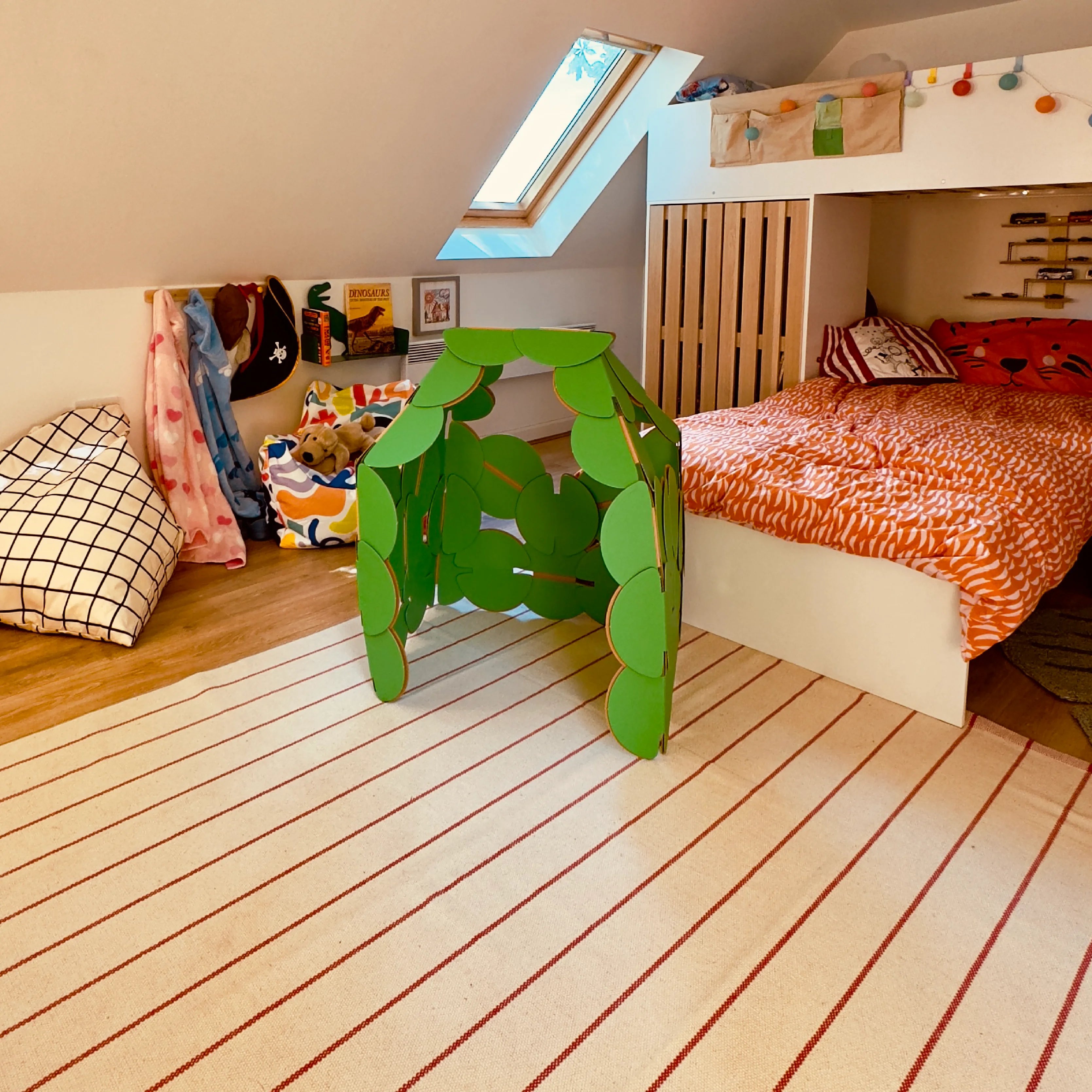 A noook® den sits in a kid's bedroom. Made with 38 noook® discs.