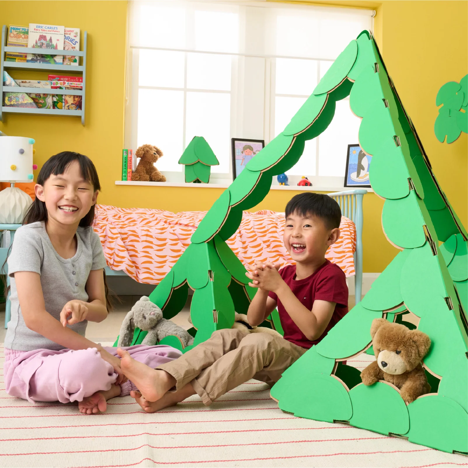 A brother a sister are playing 
with their teddy bears in a large pyramid made out of a noook play® building kit. Other objects in the children's' bedroom are also made of out of noook play® discs.
This pyramid took 69 noook play® discs to build.