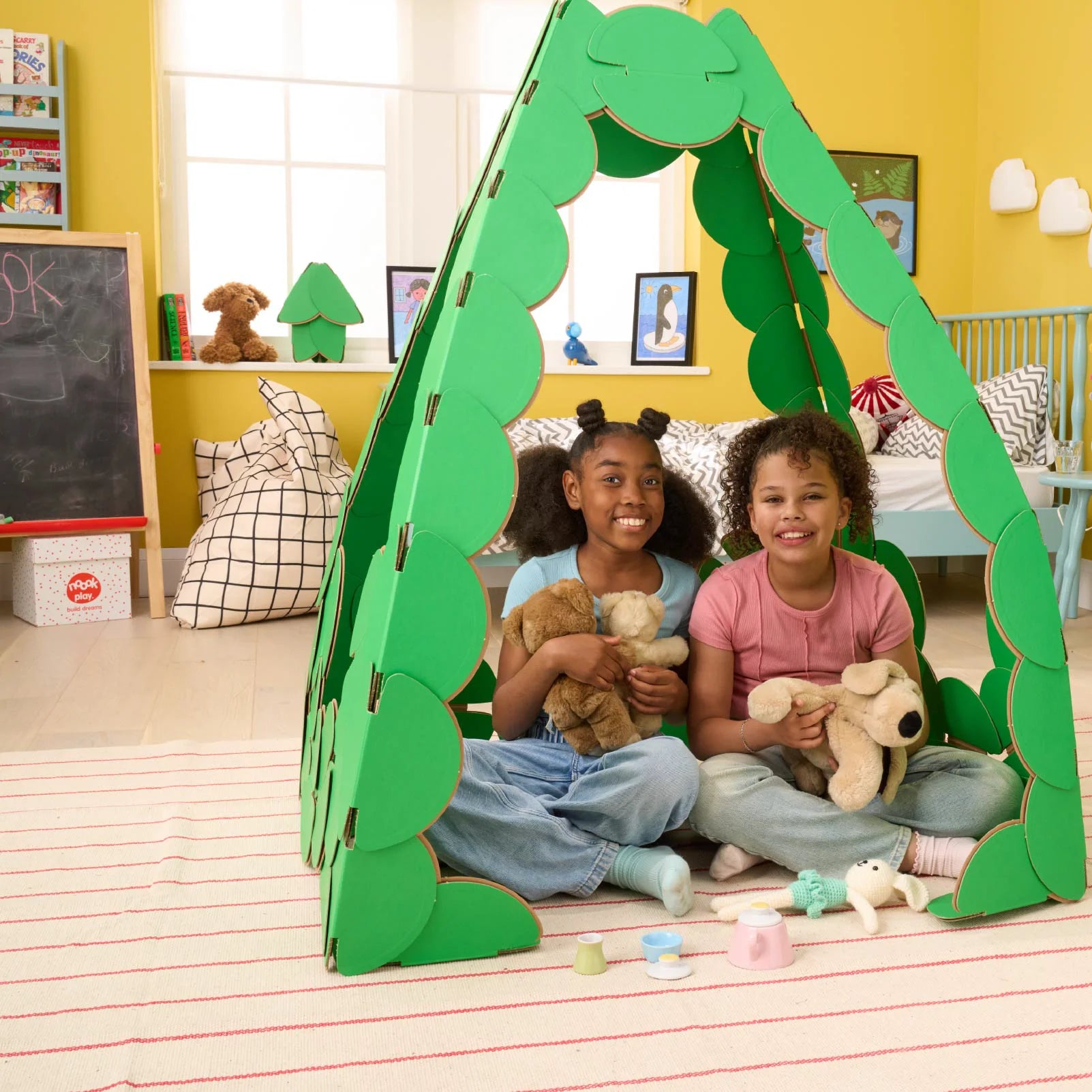Children build a Tea House with 60 noook play® discs, creating a calm, imaginative space for play