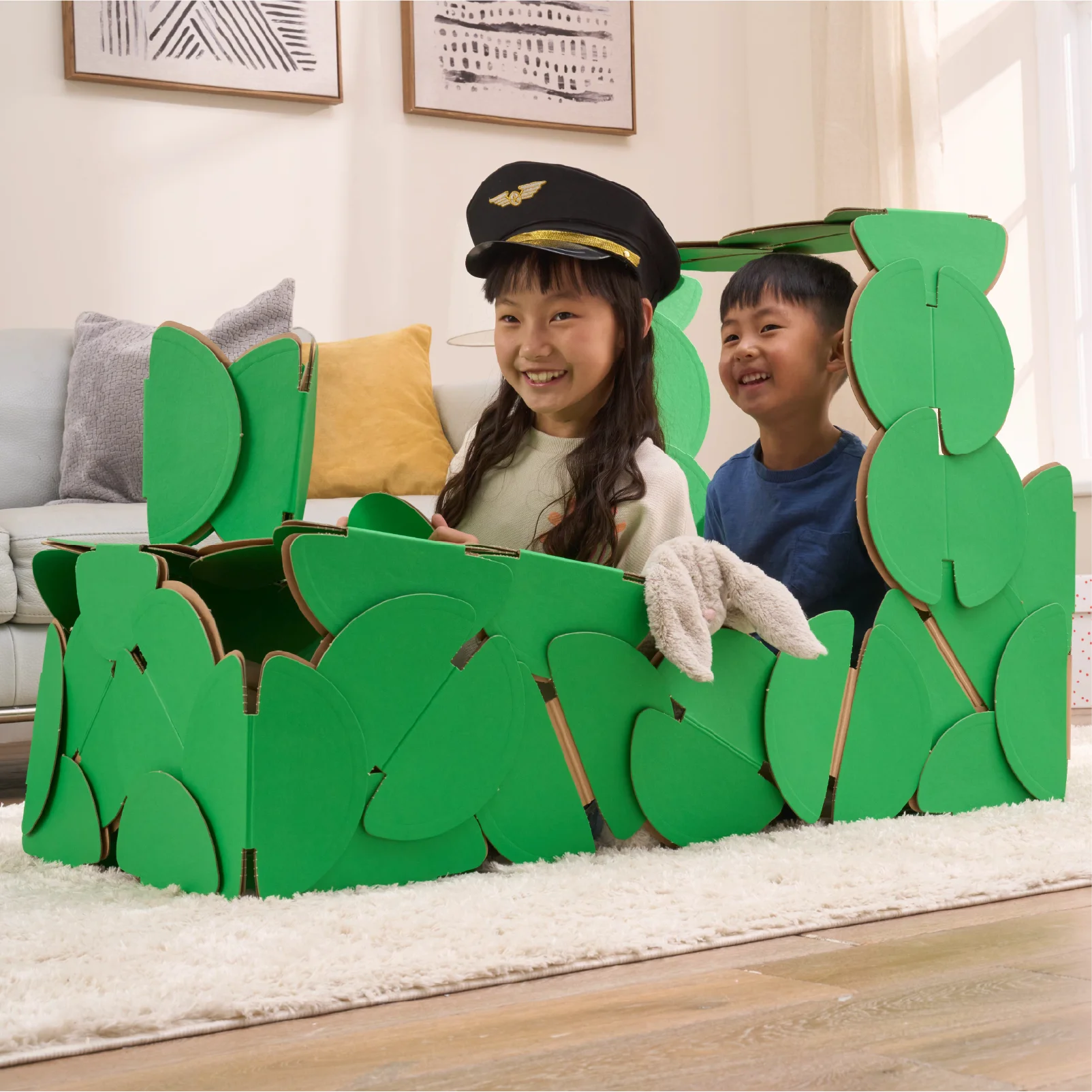 A brother and sister are playing train drivers in a steam train made out of a noook play® building kit.
This train took 51 noook play® discs to build.