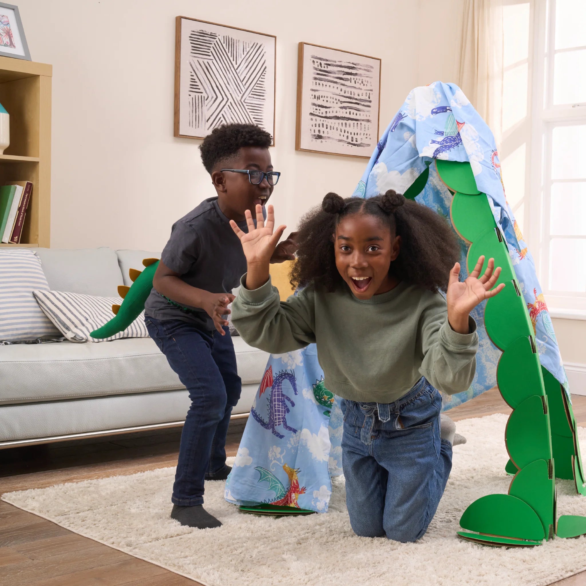 Two kids are playing in a living room, pretending to find dragons in a lair made out a noook play® building kit. The noook® den supports a sheet with dragons on.
This Dragon's Lair took 30 noook play® discs to build.