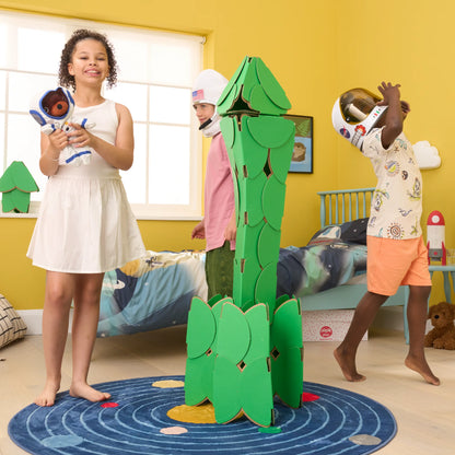 Children build a rocket with 40 noook play® discs, designing a life-sized structure for imaginative play
