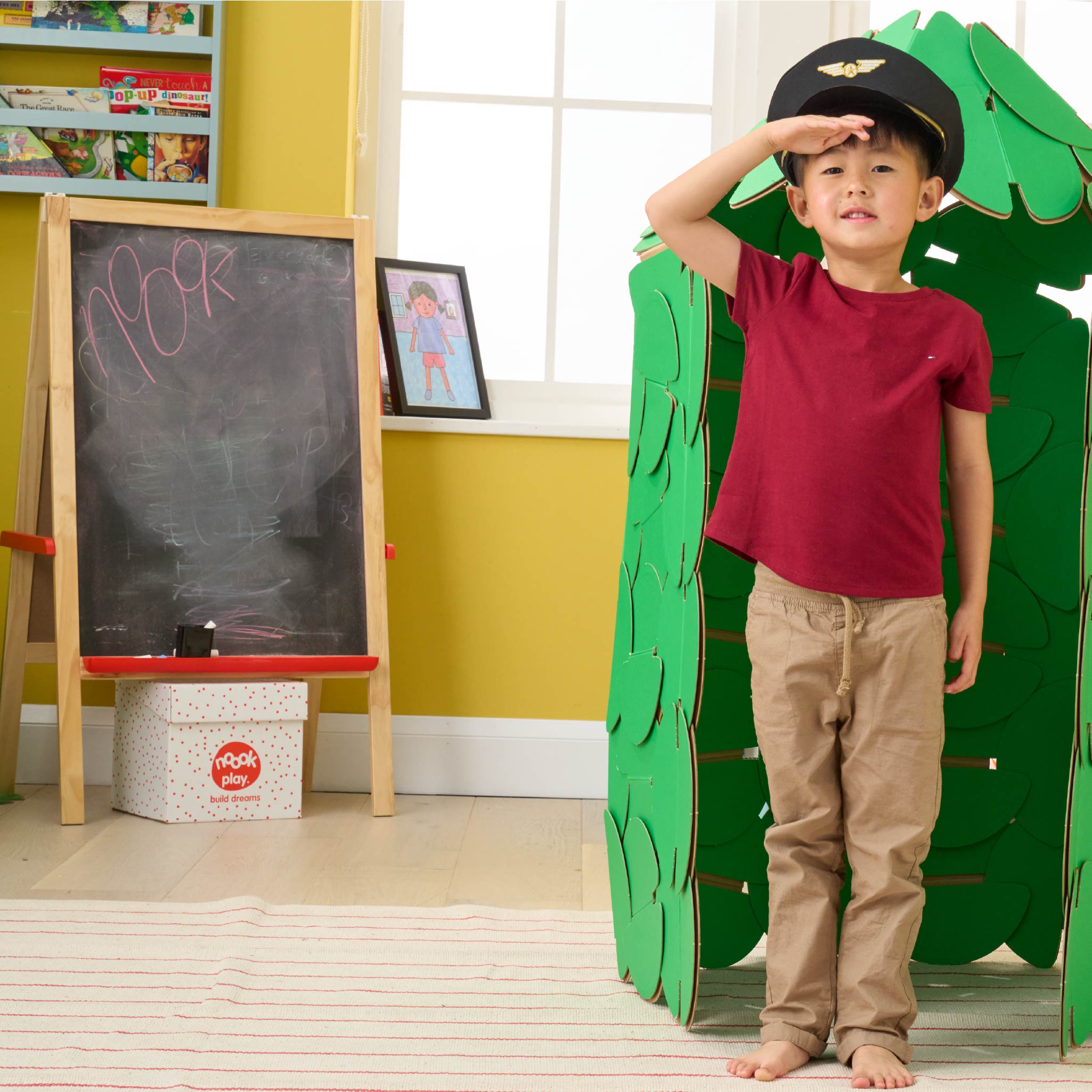 A little boy pretends to be a palace guard, protecting his bedroom from his sister, with a Guards' Hut made out of a noook play® building kit.
This guard hut took 91 noook play® discs to build.