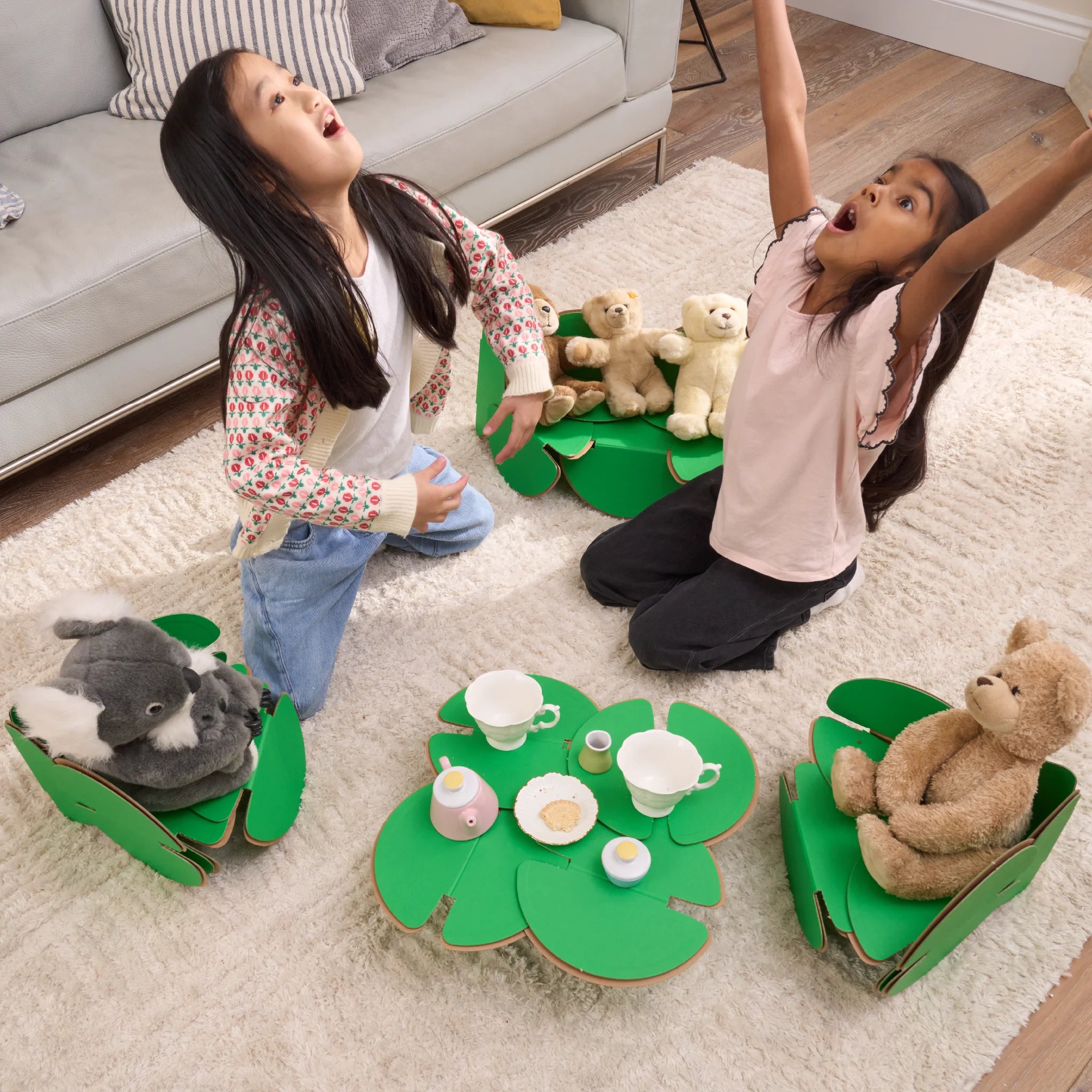 Two little girls are hosting a tea party with their favourite teddies in their sitting room. The tea party is made out of a noook play® building kit.
This Tea Party took 31 noook play® discs to build.