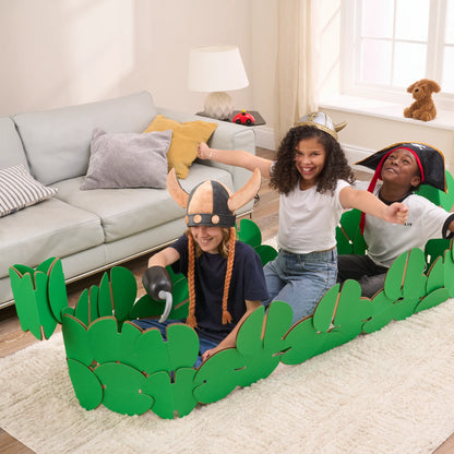 Three kids are playing in a sitting room, pretending to be Vikings on a raid. They're playing in a Viking longboat made of our a noook play® building kit. Two kids are wearing Viking horned helmets and one is wearing a Pirates' hat.
This Viking Longboat took 46 noook play® discs to build.