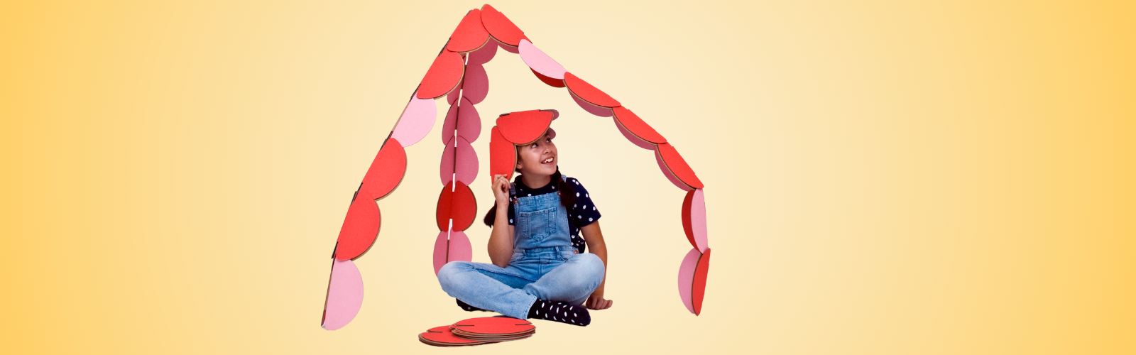 A child bringing her imagination to life with noook play construction toys.